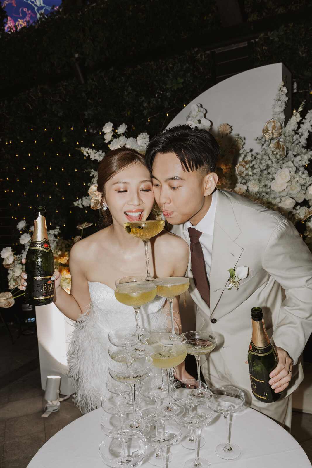 Couple toasting with champagne tower